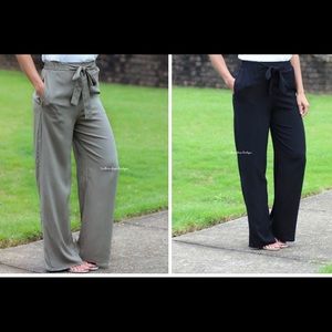 Wide leg pants in olive and black.